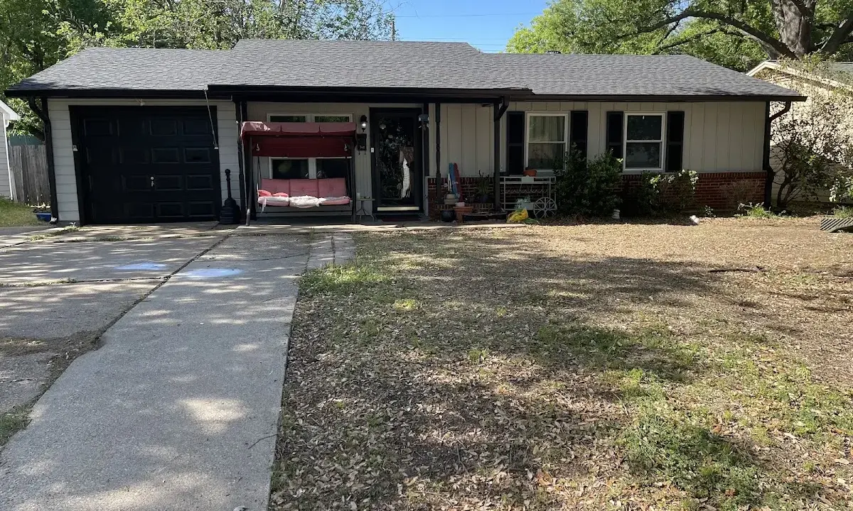 Wind Damage Roof Repair crew at work on a residential roof in Lumberton